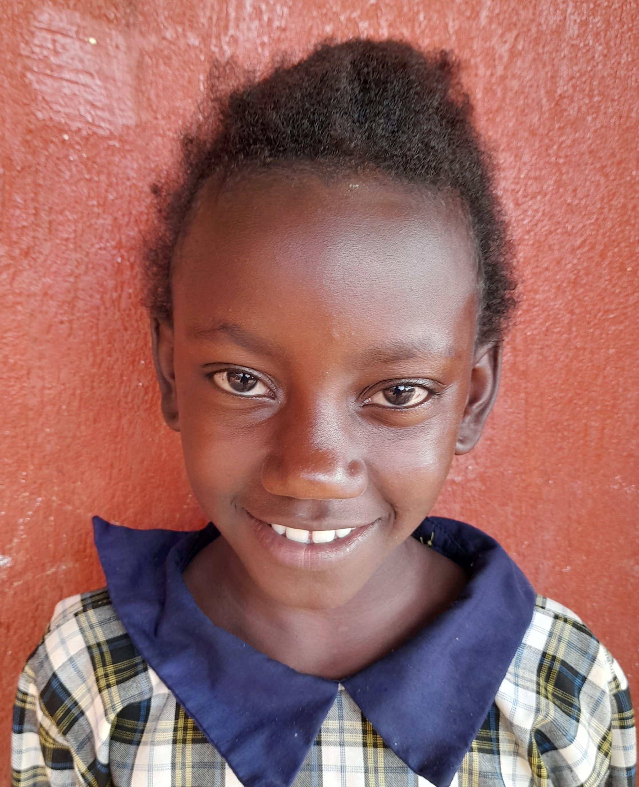 Daniella Mulungi, 10years old, she’s in P.5 class. likes gosple music and Cultural dance.jpg