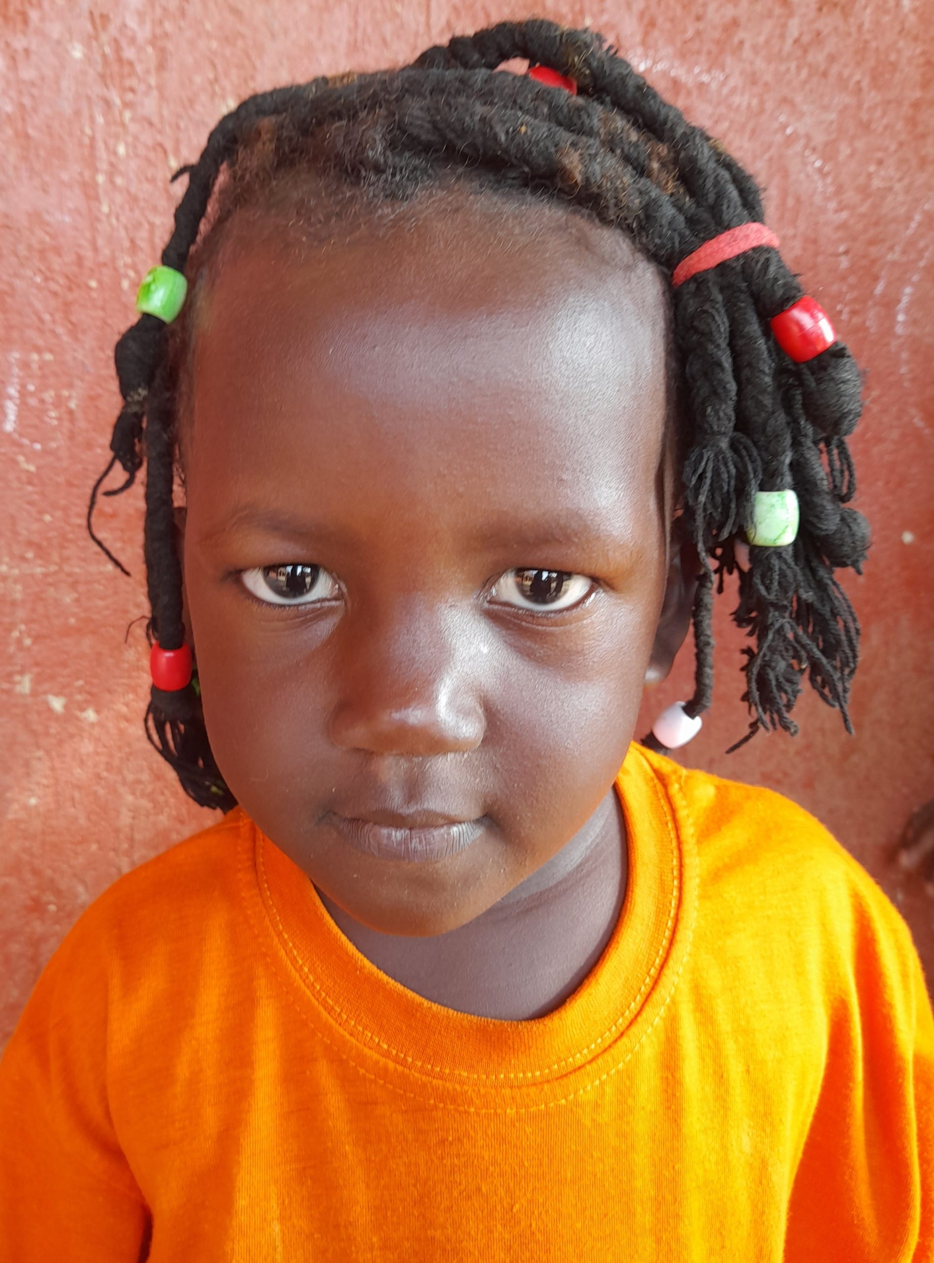 Divine Mirembe, 4 yrs old, she’s in Baby class, loves singing and dancing.jpg