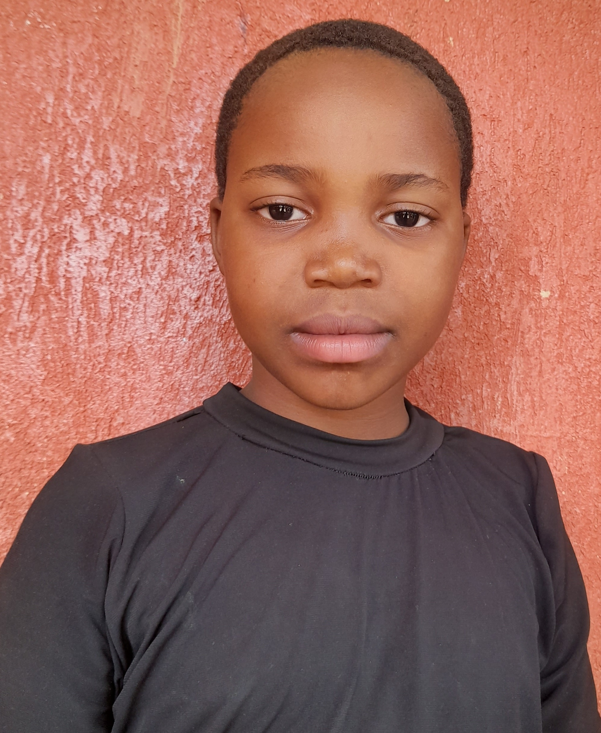 Paskaline Gikundilo, 9 years old, she’s in primary three, like singing and dancing.jpg