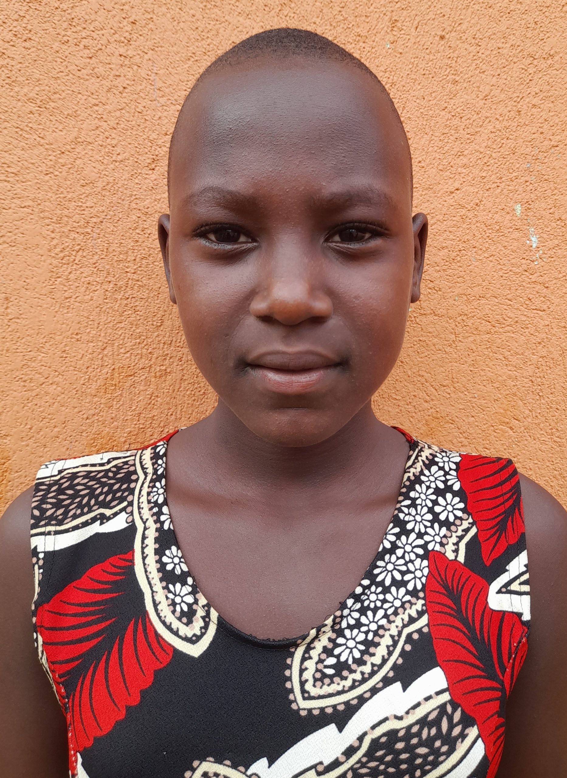 Regina Najjuko, 13 years old, she’s in primary six, likes playing netball..jpg