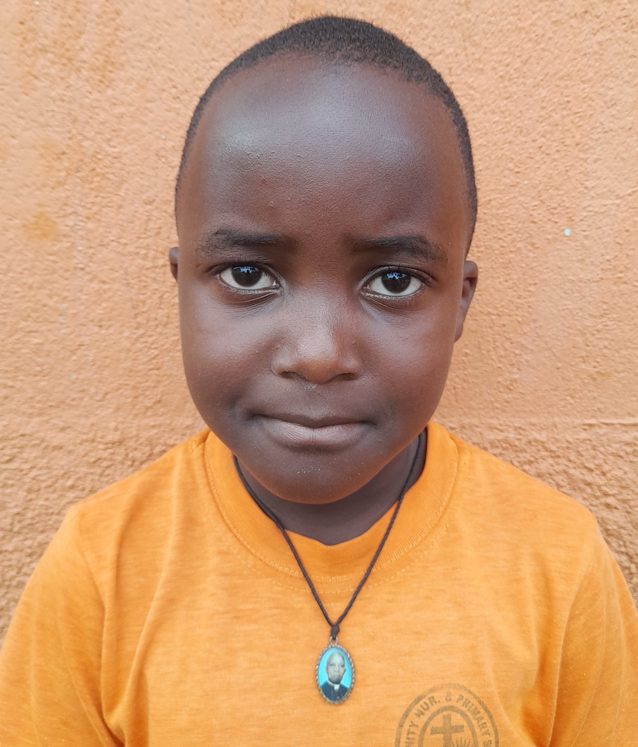 Timothy Lubiinga, 8 years old, he’s in primary three, likes playing football..jpg