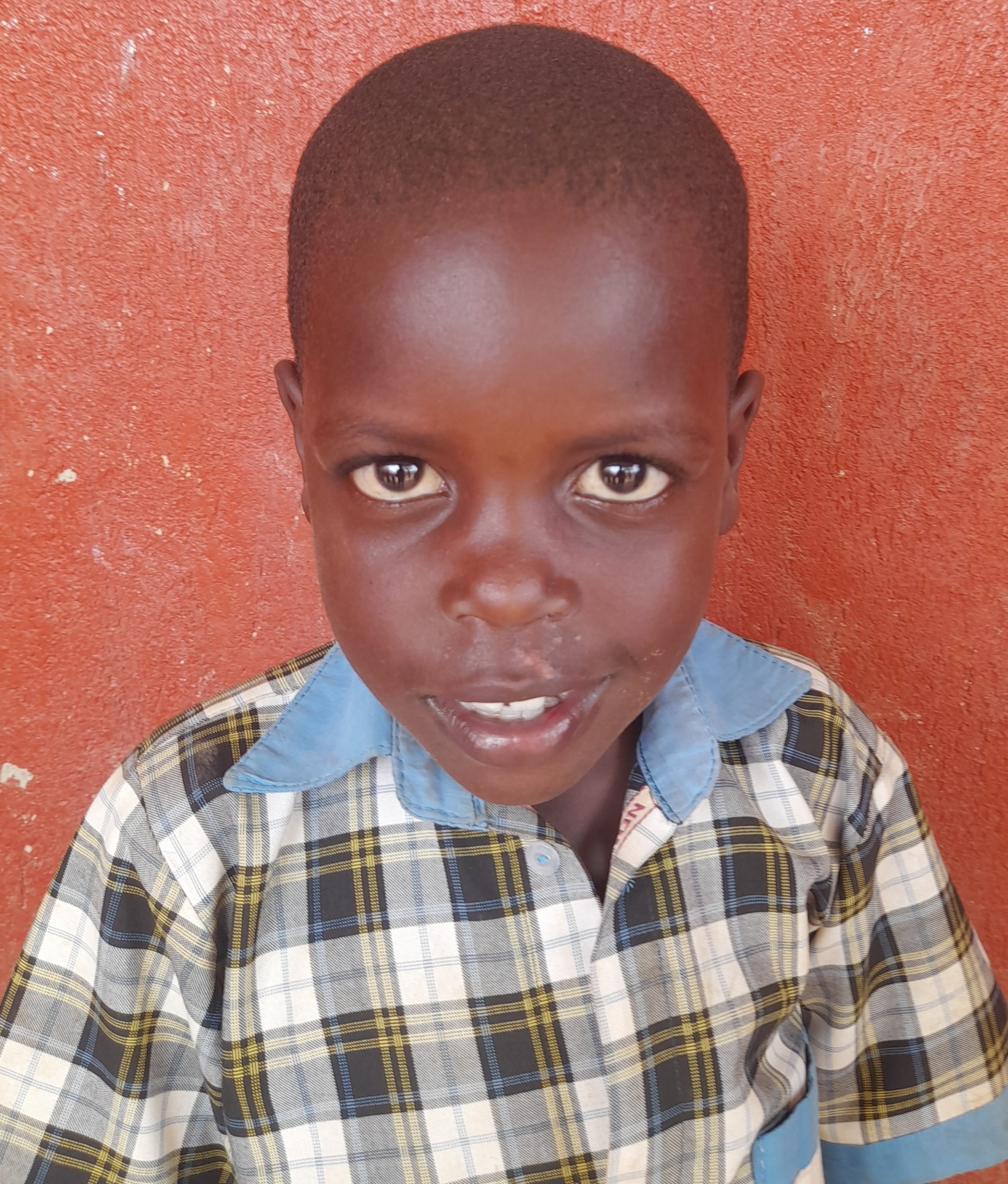 Victory Ssewaya, 8 years old, he’s in primary two, likes playing games.jpg